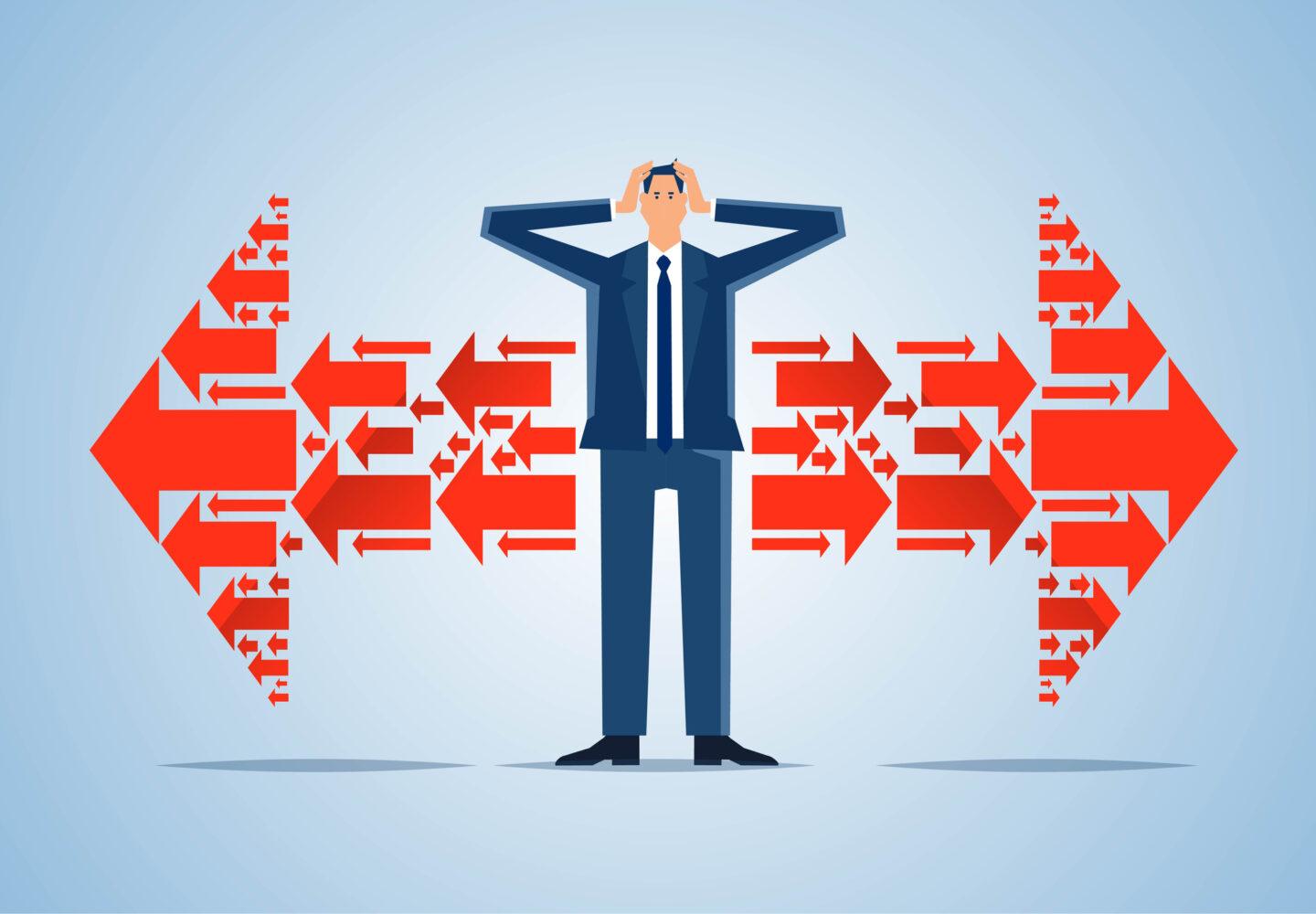 Na grafice mężczyzna w garniturze łapie się za głowę obiema rękami na tle czerwonych strzałek.
