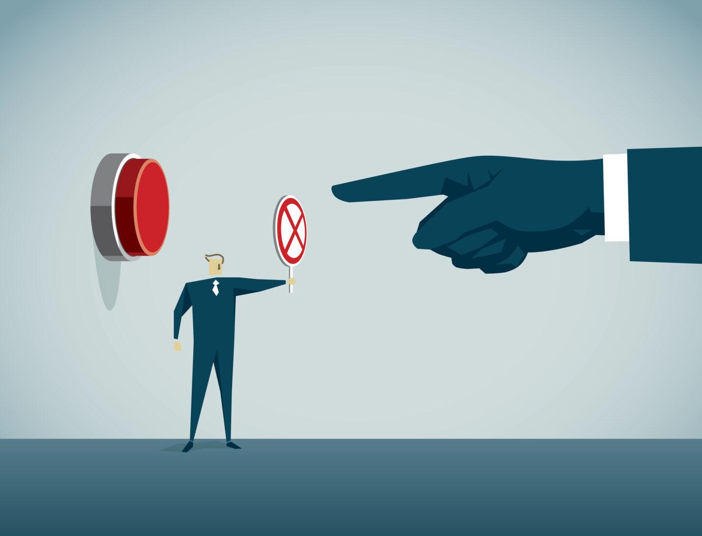 Na grafice mężczyzna w garniturze zabrania wciśnięcia przycisku