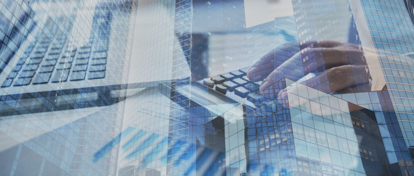 Modern buildings in the backgroud of an office full of computers