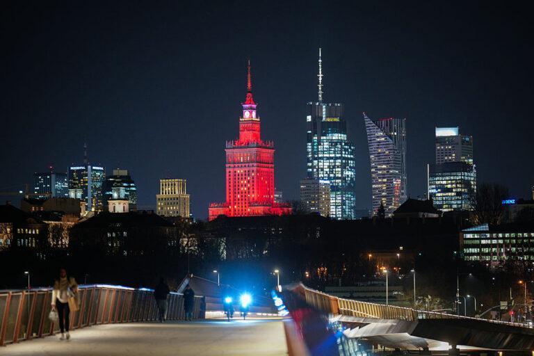The city skyline is seen from the pedestrian bridge over the Vistula river in Warsaw