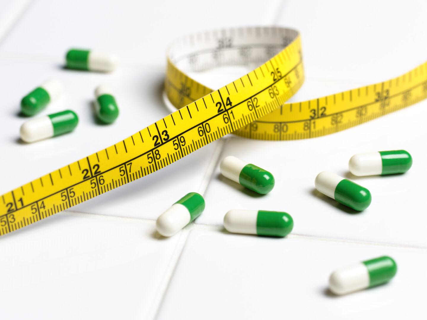Diet pills with tape measure