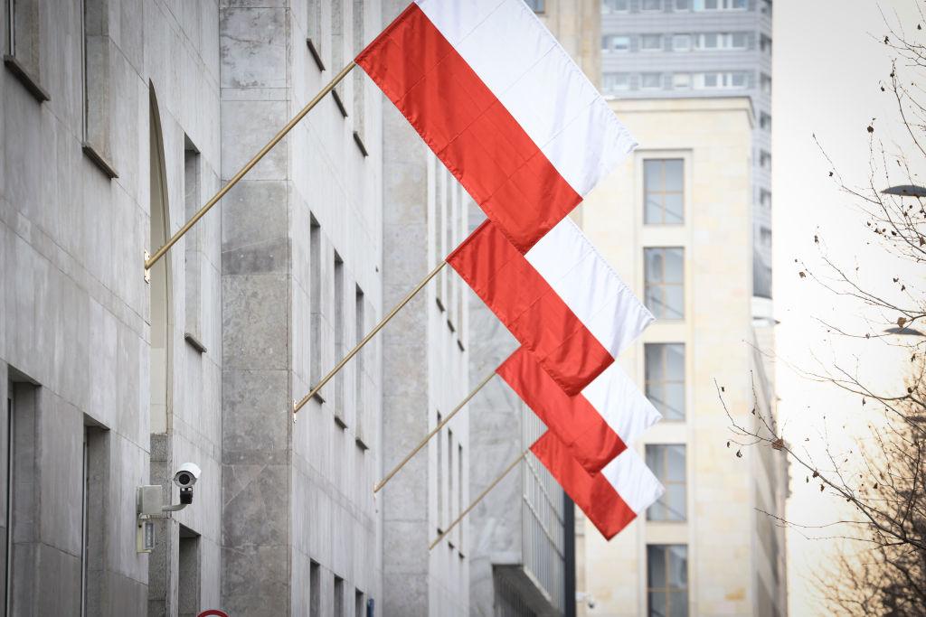 Polish flags are seen hanging from the Polish National Bank in Warsaw