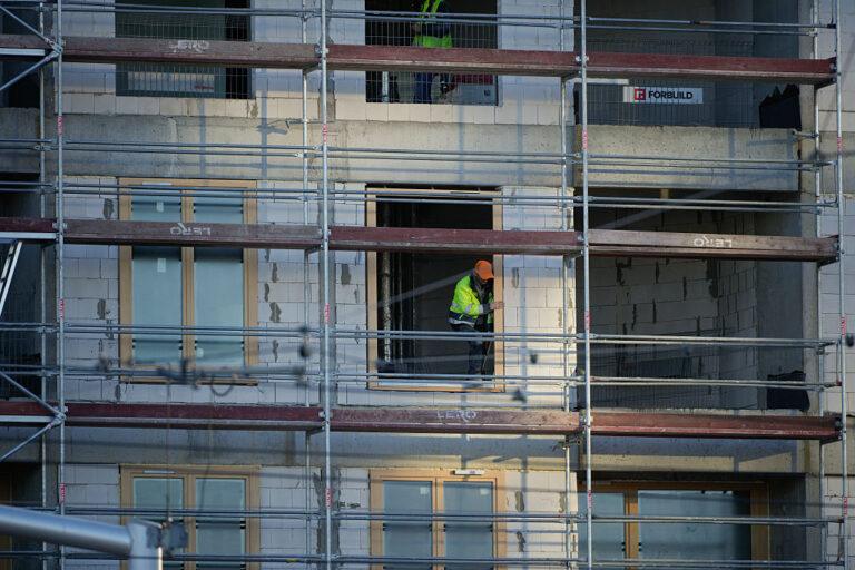 Workers are seen in building under construction