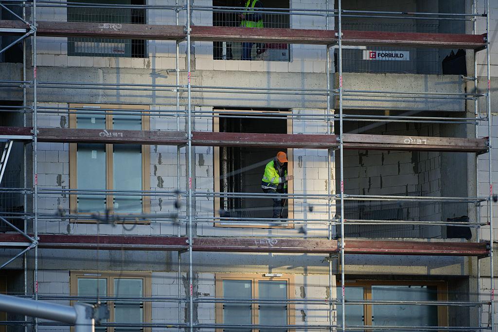 Workers are seen in building under construction