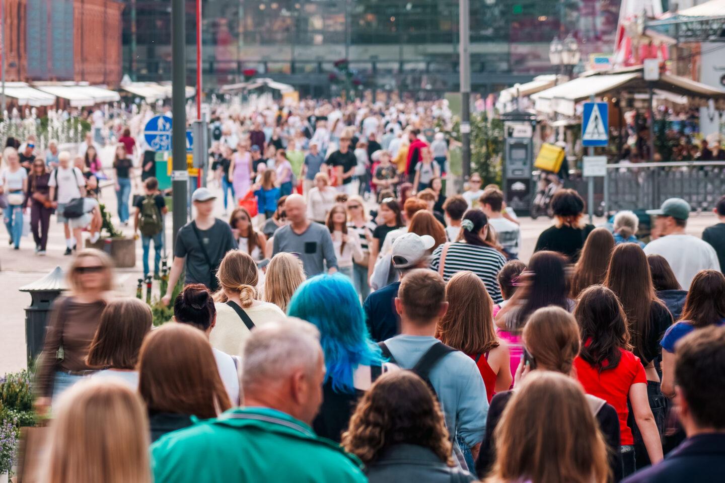 Crowded street urban life city crowd. Large group of people walking in busy downtown area on a sunny day, reflecting vibrant city atmosphere and diverse urban lifestyle