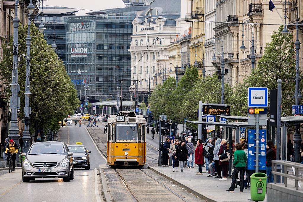 tram runs on Liberty Bridge in Budapest,